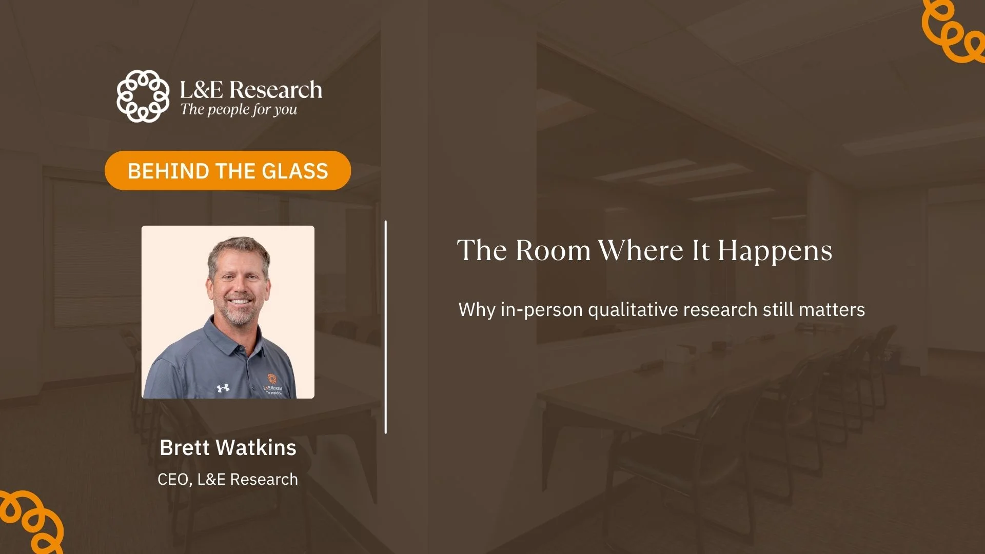 A headshot of CEO Brett Watkins and a room in the background